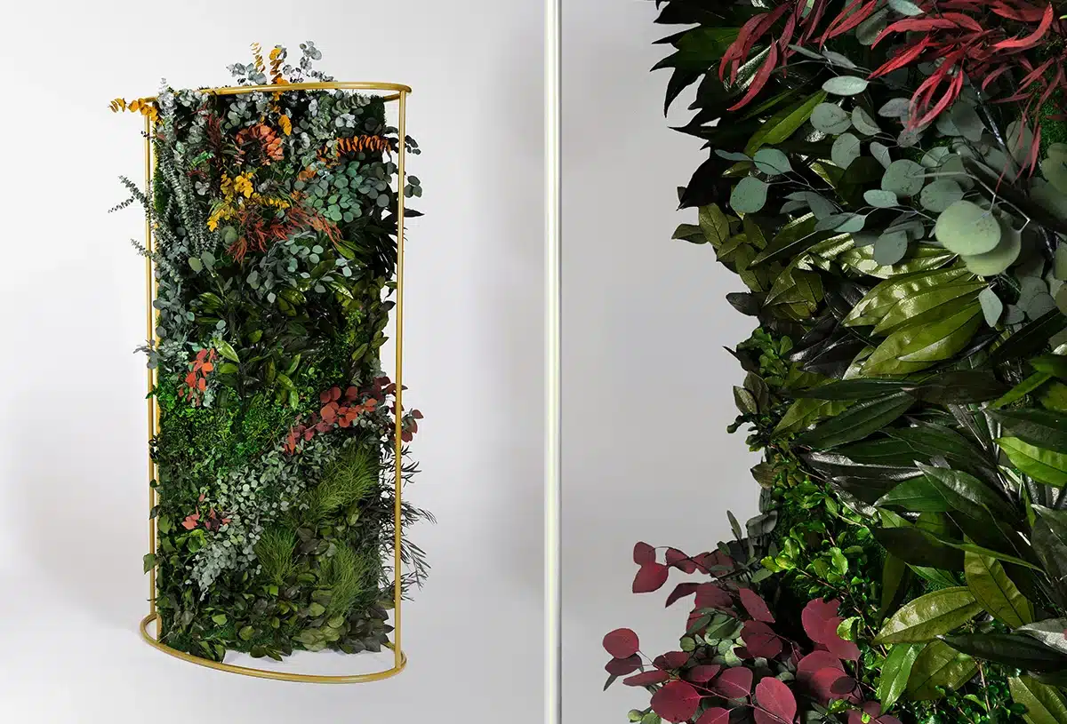 Decorative green plant wall with colorful foliage arrangement.