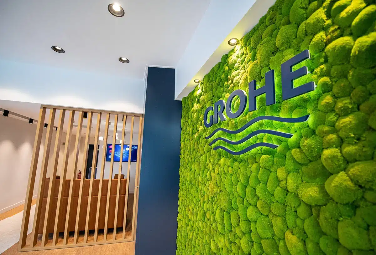 Green moss wall with Grohe logo