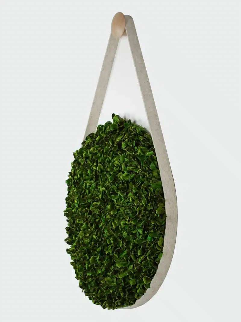 Green vertical wall planter with leaves