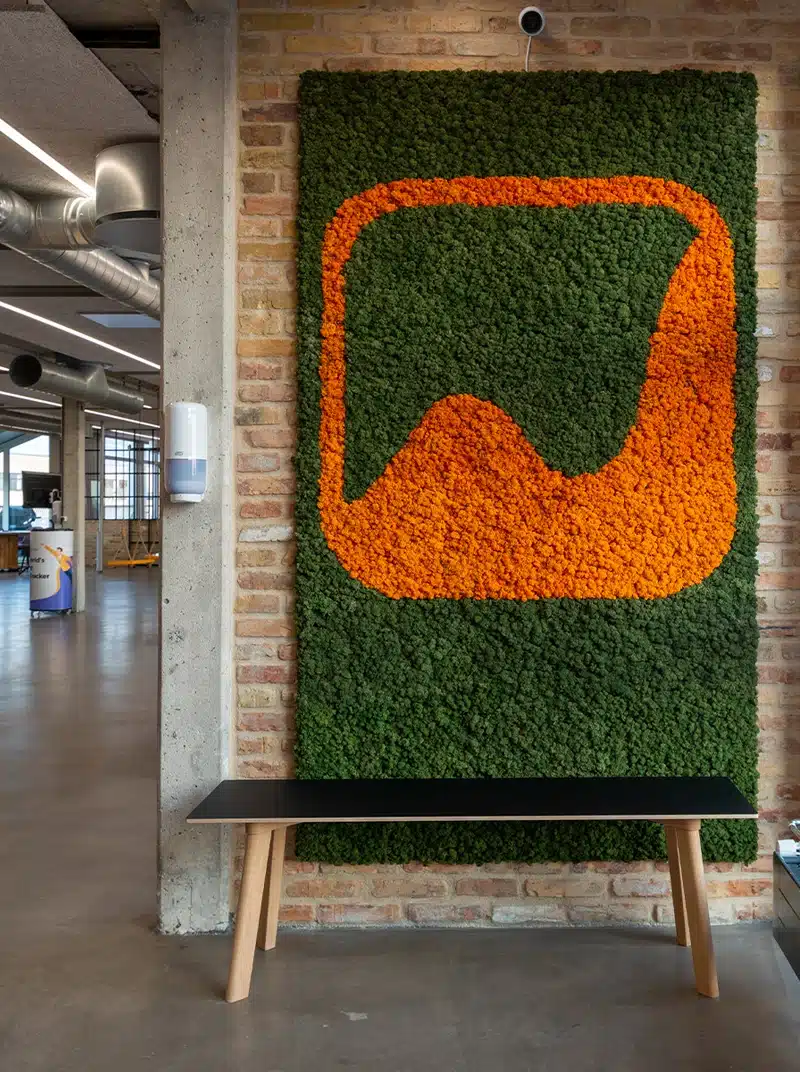 Moss wall art with abstract orange and green design