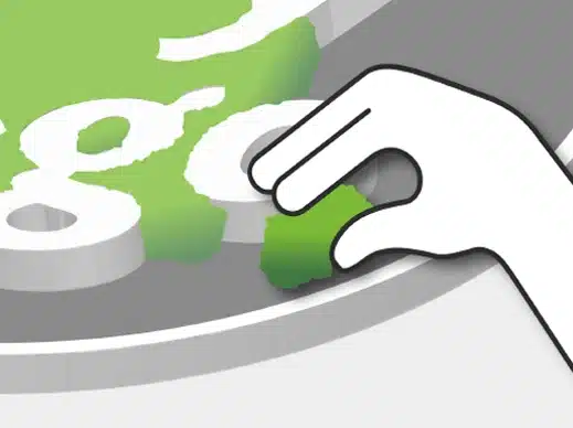 Creative hand adjusting letters on green background.